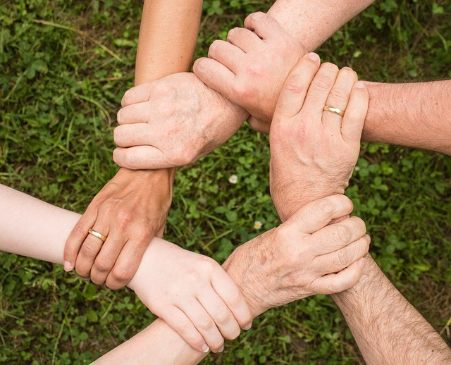 Hands holding each other.